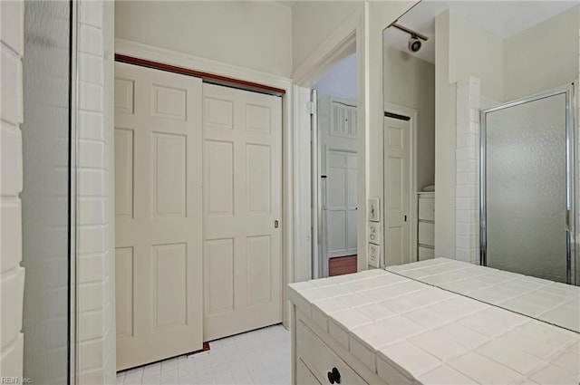 bathroom with a shower stall