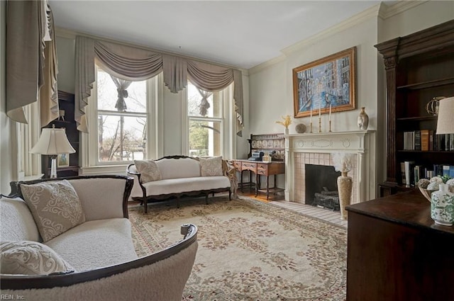 living area featuring ornamental molding, a tiled fireplace, and built in features