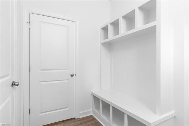 mudroom featuring dark wood-style floors