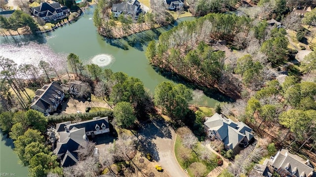 birds eye view of property with a residential view and a water view