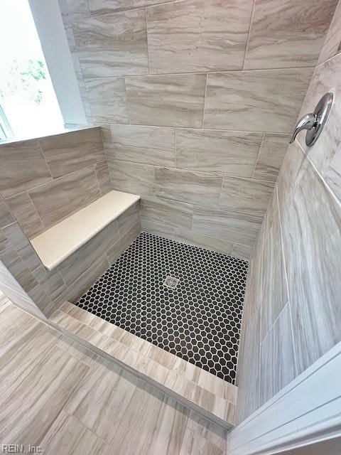 details featuring a tile shower