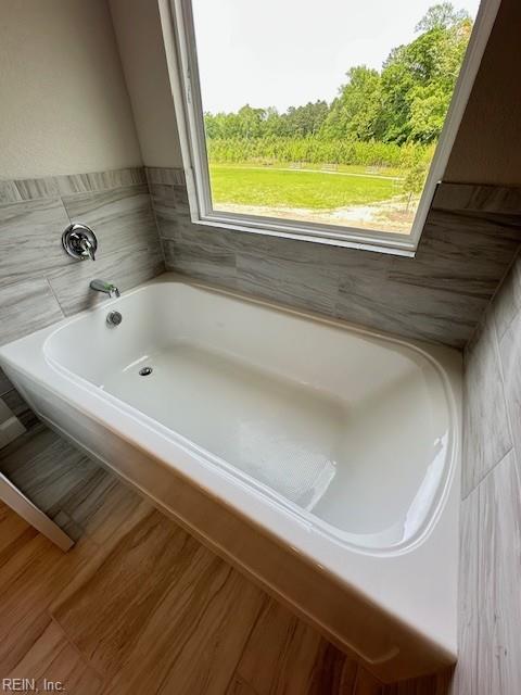 full bathroom featuring a garden tub