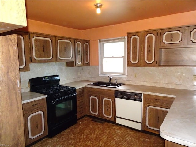 kitchen with brown cabinetry, gas stove, dishwasher, and a sink