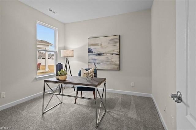 office area featuring carpet, visible vents, and baseboards