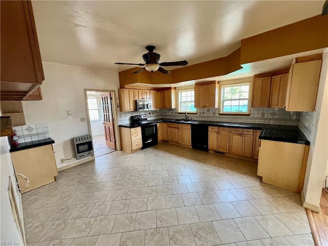 kitchen with heating unit, dark countertops, decorative backsplash, a ceiling fan, and black appliances