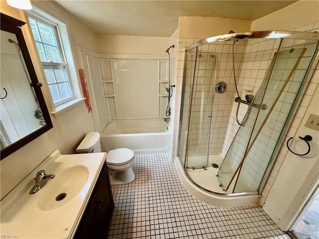 full bath with toilet, a washtub, tiled shower, and vanity