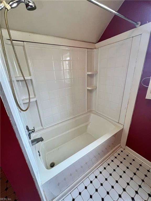 full bath with lofted ceiling and tub / shower combination