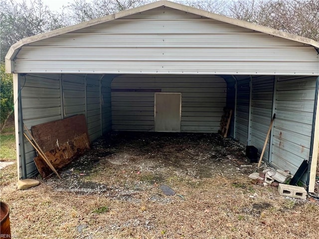 garage featuring a detached carport