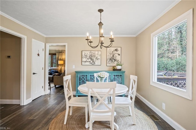 dining area with a wealth of natural light, a chandelier, dark wood finished floors, and baseboards