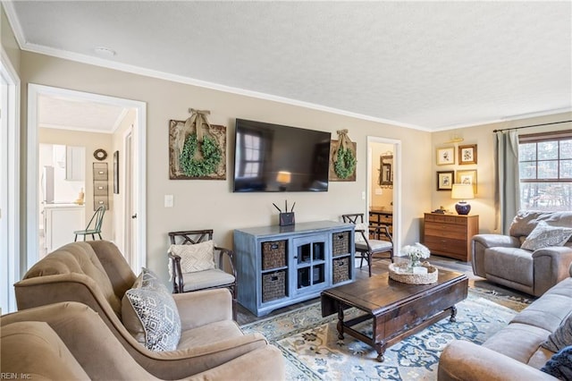 living room featuring a textured ceiling, wood finished floors, and crown molding