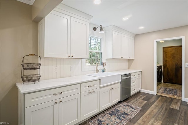 kitchen with dishwasher, recessed lighting, dark wood-style floors, white cabinetry, and a sink