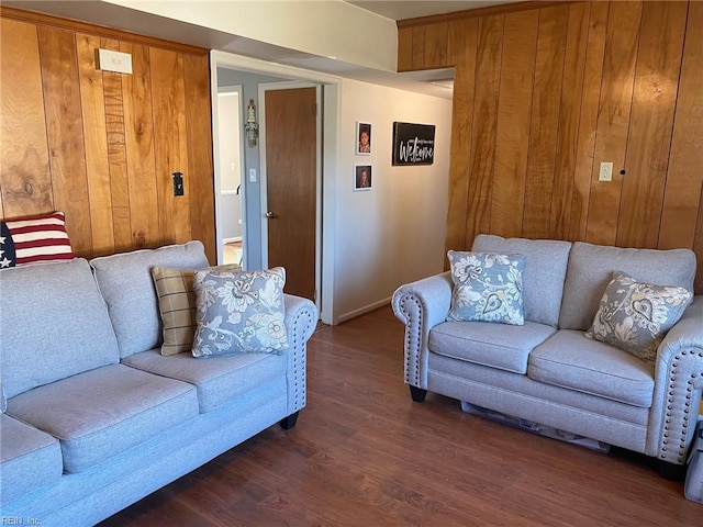 living room featuring dark wood-style floors and wooden walls