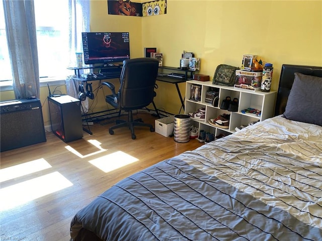 bedroom with wood finished floors