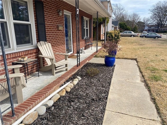 view of yard with covered porch