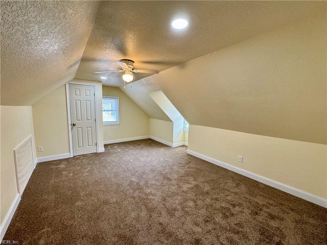 additional living space with visible vents, baseboards, lofted ceiling, ceiling fan, and carpet floors