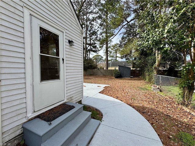 doorway to property with fence