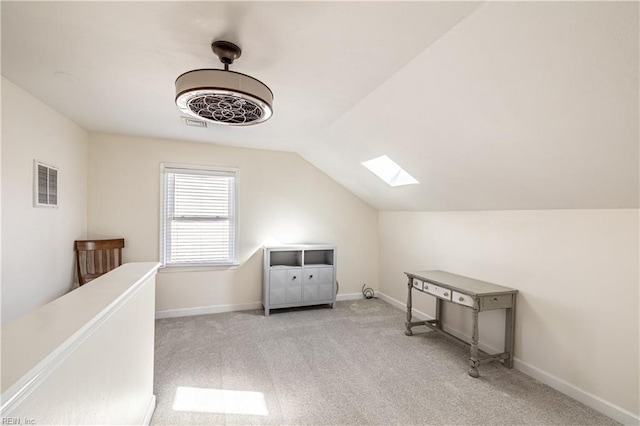 bonus room with lofted ceiling with skylight, carpet, visible vents, and baseboards