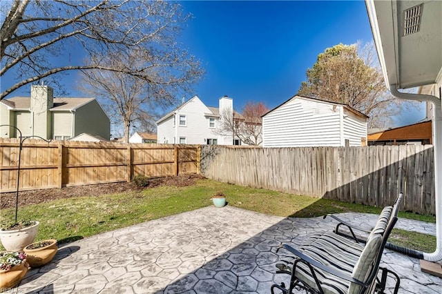 view of patio / terrace featuring a residential view and a fenced backyard