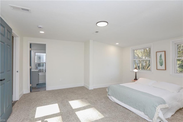 bedroom with recessed lighting, baseboards, visible vents, and light colored carpet