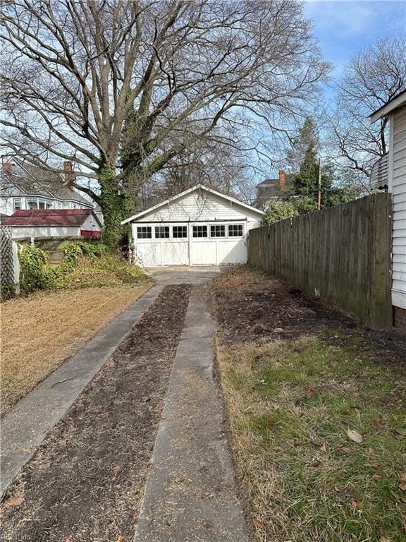 detached garage with fence