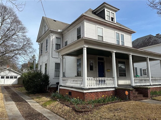 traditional style home featuring a porch and a garage