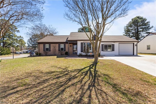 single story home featuring brick siding, driveway, a front yard, and an attached garage