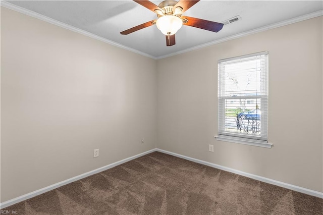 carpeted spare room featuring visible vents, baseboards, ceiling fan, and crown molding