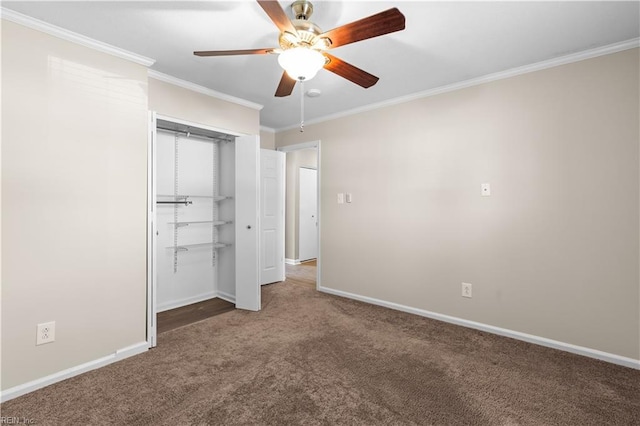 unfurnished bedroom with carpet, baseboards, ceiling fan, ornamental molding, and a closet