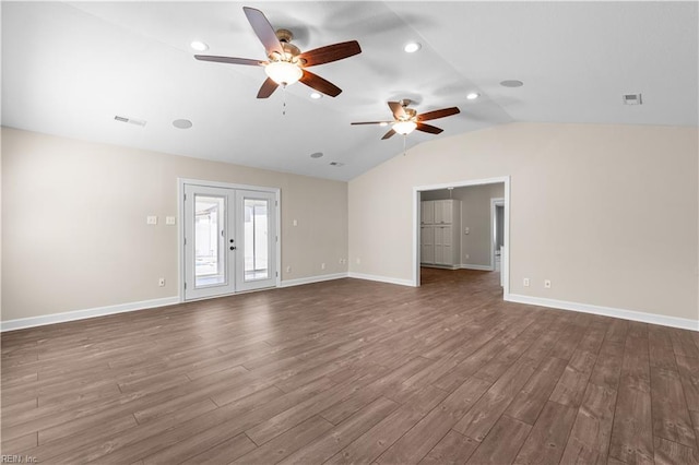 unfurnished living room with dark wood-style floors, french doors, baseboards, and vaulted ceiling