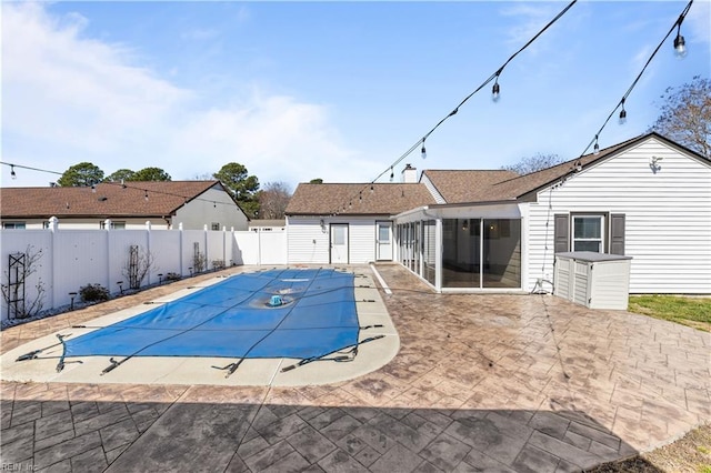 view of pool featuring a patio, a fenced backyard, and a fenced in pool