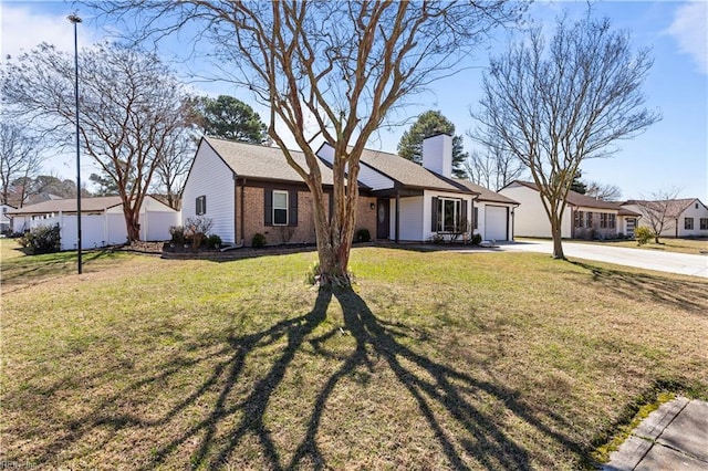 single story home with driveway, a front lawn, an attached garage, brick siding, and a chimney