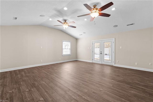 interior space featuring visible vents, baseboards, lofted ceiling, french doors, and dark wood-style floors