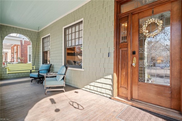 entrance to property featuring covered porch