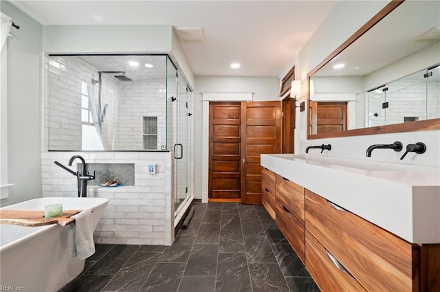 bathroom with vanity, a soaking tub, recessed lighting, a shower stall, and marble finish floor