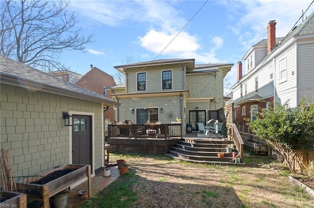 back of property featuring a deck