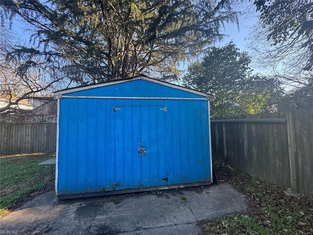 view of shed with a fenced backyard