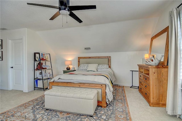 bedroom with baseboards, carpet floors, lofted ceiling, and visible vents