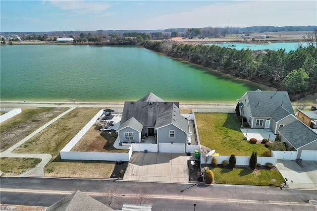 birds eye view of property featuring a water view