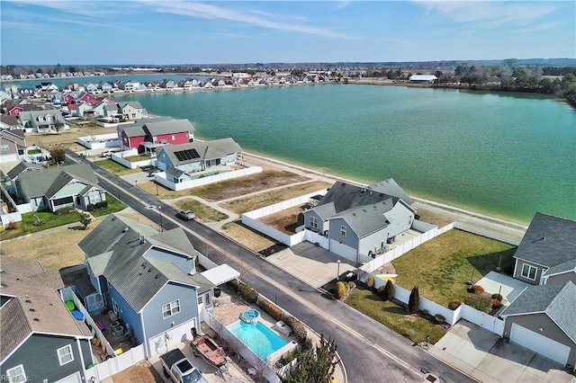 bird's eye view featuring a residential view and a water view