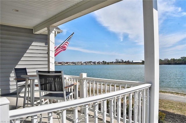 wooden terrace with a water view