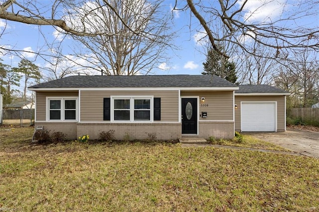 ranch-style house featuring brick siding, a front lawn, fence, a garage, and driveway