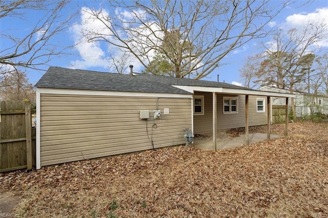 view of home's exterior featuring a patio area and fence