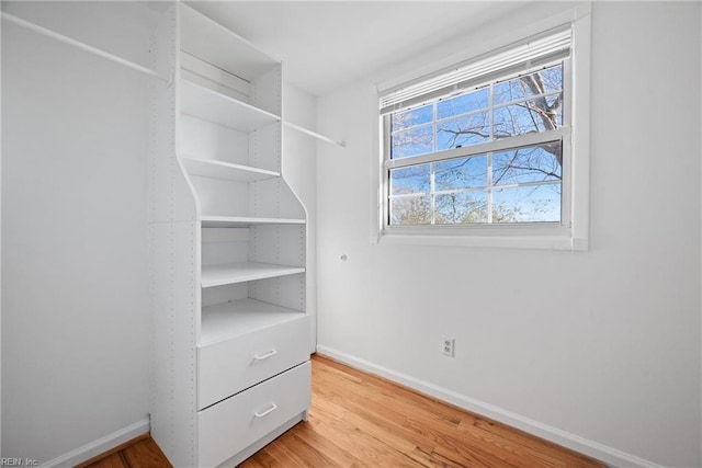 spacious closet with light wood-style floors