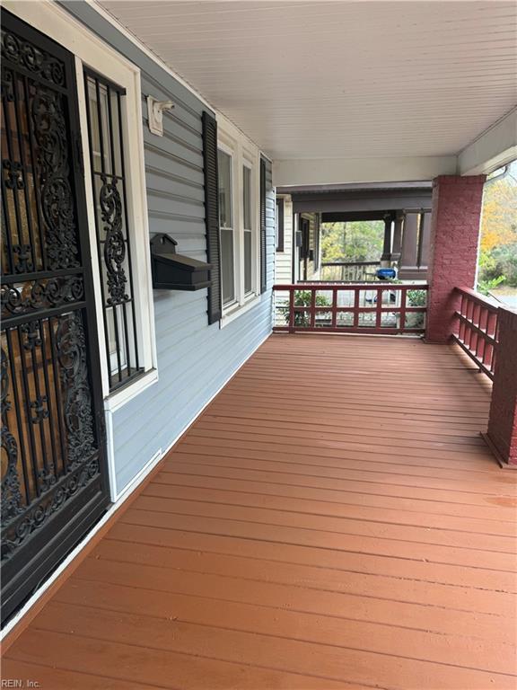 wooden deck featuring a porch