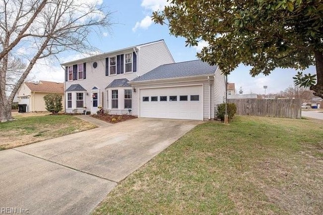 colonial inspired home featuring an attached garage, concrete driveway, a front lawn, and fence