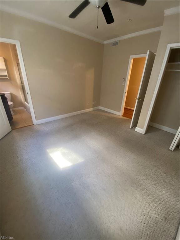 unfurnished bedroom featuring visible vents, baseboards, and ornamental molding