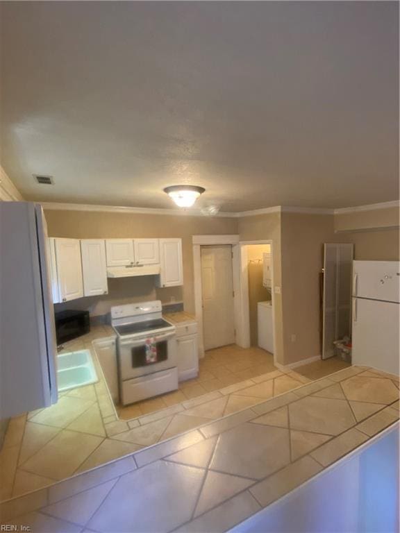 kitchen with visible vents, under cabinet range hood, white cabinetry, white appliances, and tile counters