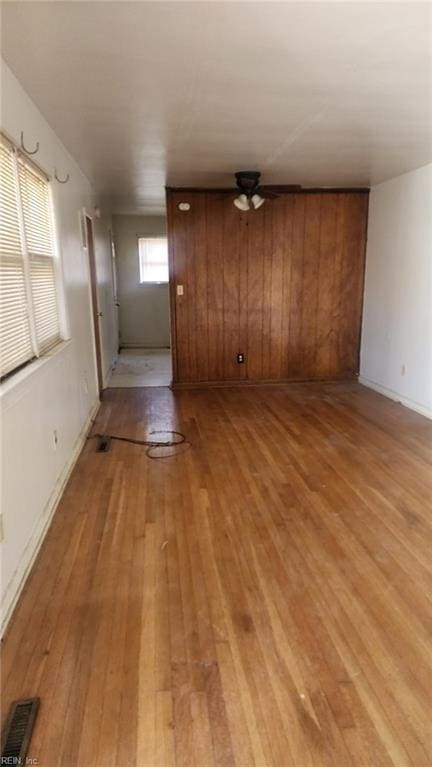 unfurnished living room with light wood-style floors and visible vents