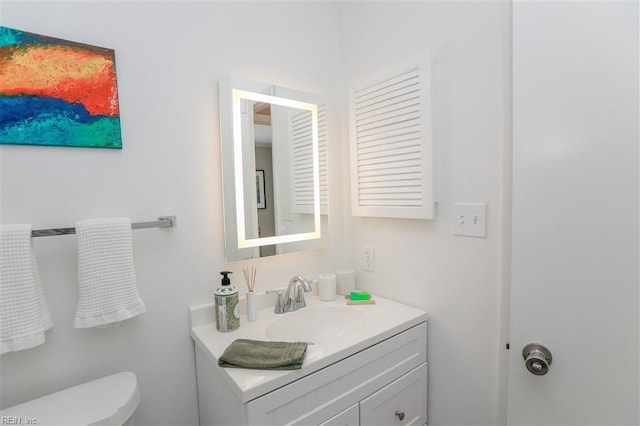 half bath with vanity and toilet