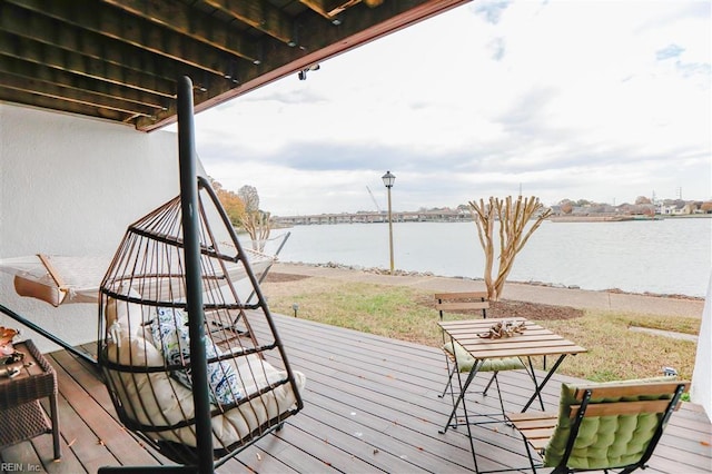 wooden deck featuring a water view